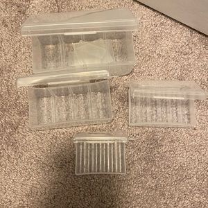 4 plastic boxes that hold batteries